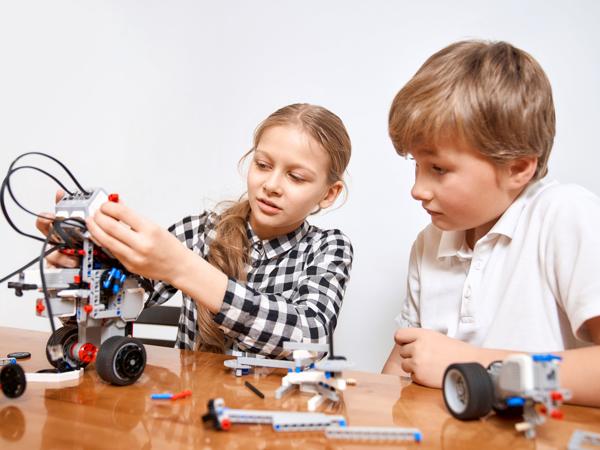 Kids building robot with magnetic blocks