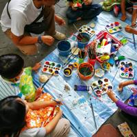 Children painting outdoors