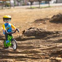 Boy riding bicycle outdoors