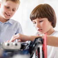 Teenagers building robots